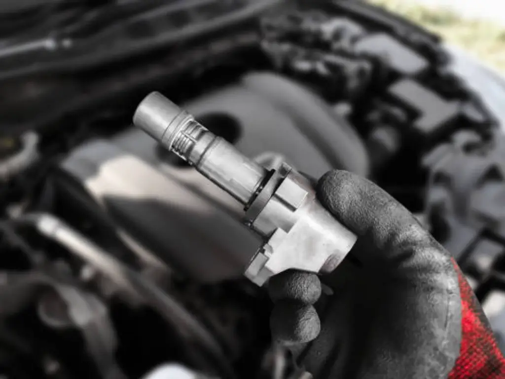 ignition coil vs spark plug cover